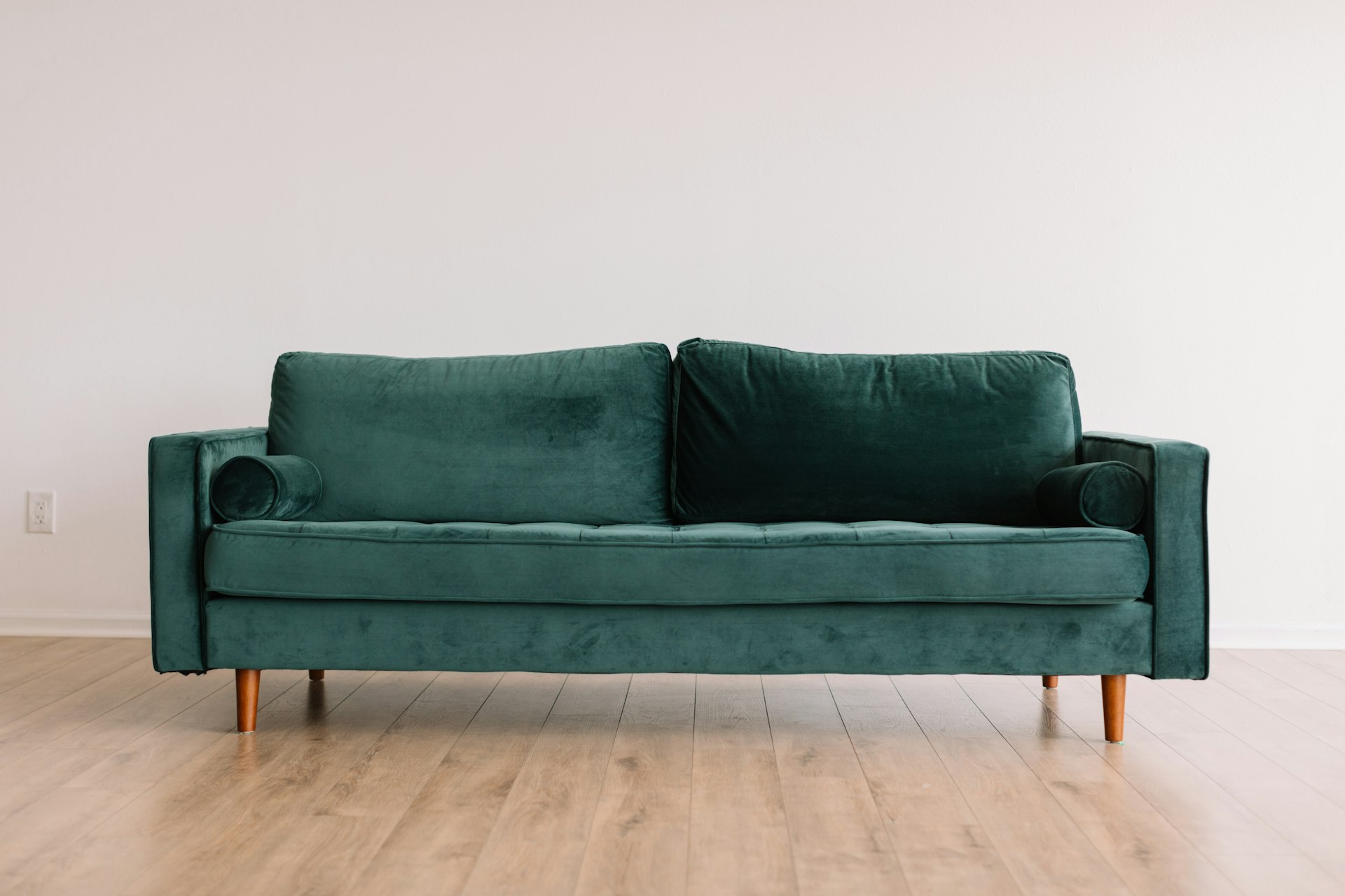 Sculptural Italian leather sofa in warm natural light — atmosphere image